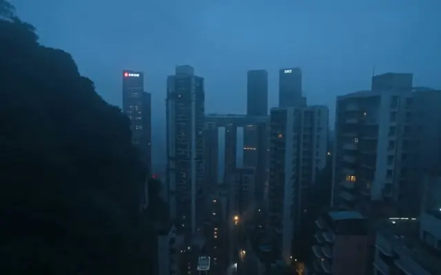 A vertical city at dusk
